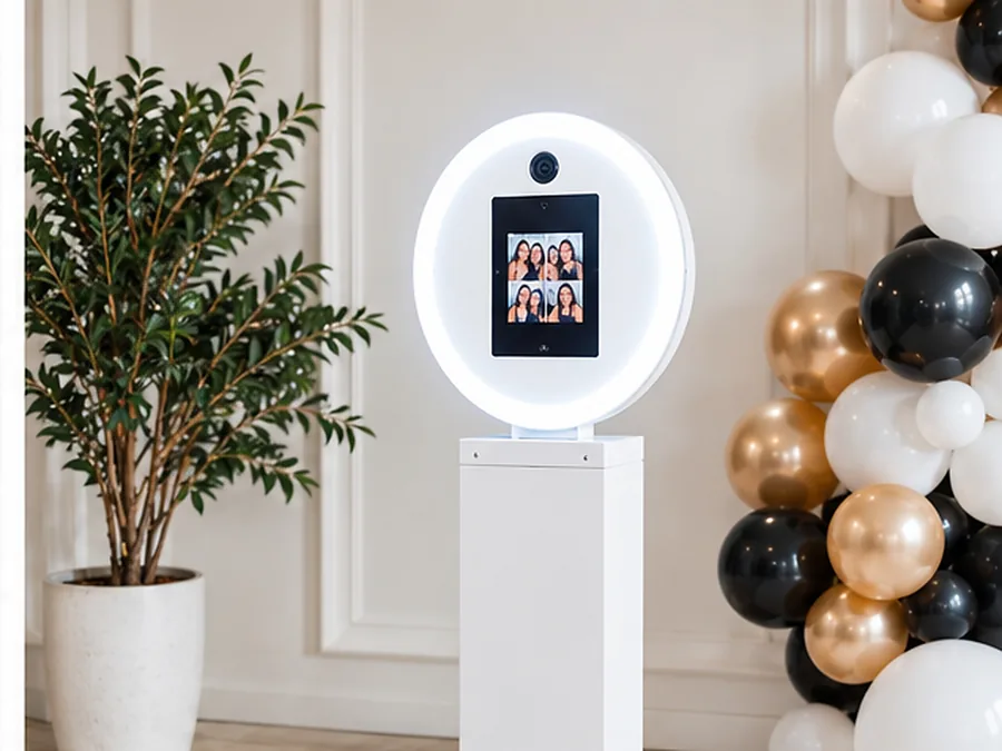 The Social: white self-service ring-light photo booth with gold and black balloons
